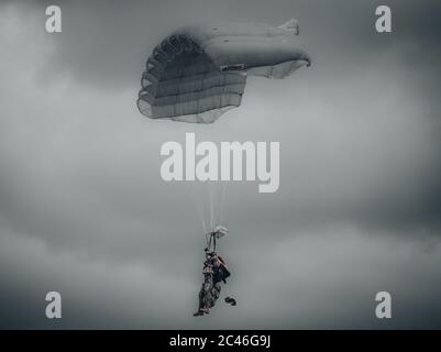 Amazing shot of an airborne forces soldier flying in the sky Stock Photo