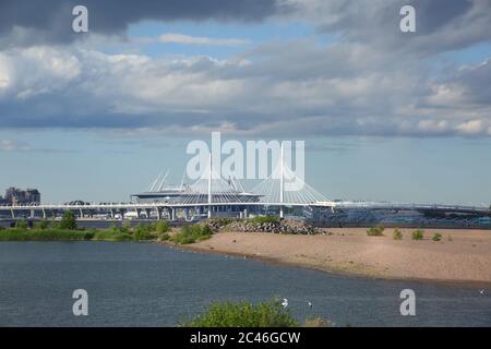 View of the Krestovsky Stadium, known as Gazprom Arena, on Krestovsky Island and the Big Obukhovsky Bridge or Vantoviy Bridge, St Petersburg, Russia. Stock Photo