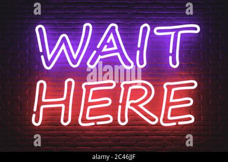 Wait Here Neon Sign extreme closeup. 3d Rendering Stock Photo