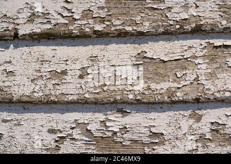 Close up of flaking paint on the side of an abandoned wooden fishing boat on Aldeburgh beach, Aldeburgh, Suffolk. UK. Stock Photo