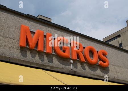 Lugano, Ticino, Switzerlad - 3rd June 2020 : Migros supermarket store logo hanging in front of a shop in Lugano. Migros company is the biggest retail Stock Photo