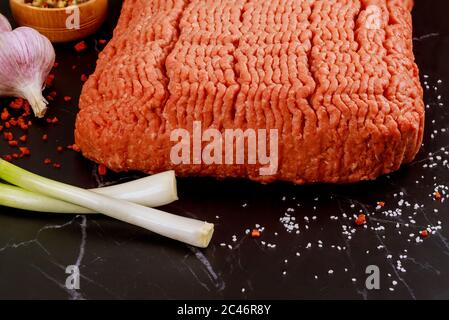 Ground beef with spice and green onion. Close up. Stock Photo