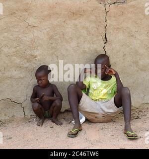 KAMANJAB, NAMIBIA - FEB 1, 2016: Little unidentified Himba children shown in himba tribe village Stock Photo