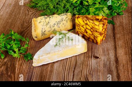 Assorted of cheese on wooden background. Close up. Stock Photo