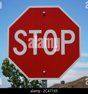 Close up of octogonal red stop sign. Stock Photo