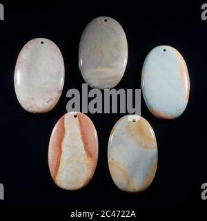 Natural multi color jasper on the black background Stock Photo