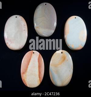 Natural multi color jasper on the black background Stock Photo