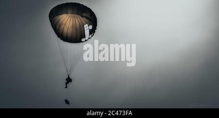 Amazing shot of an airborne forces soldier flying in the sky Stock Photo
