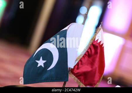 Qatar & pakistan flage on table Stock Photo