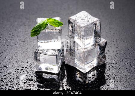 Ice cubes and mint on wet background Stock Photo