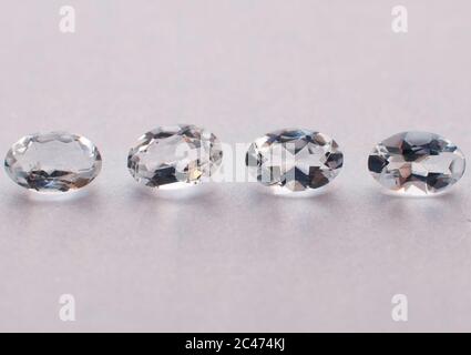 Natural white oval faceted aquamarines on the white background Stock Photo