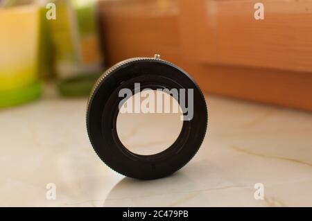 Metal lens adaptor for camera on the surface Stock Photo