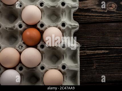 egg platon. Several white and yellow eggs. easter decoration. Eggs on a wooden background. Rustic decoration Stock Photo