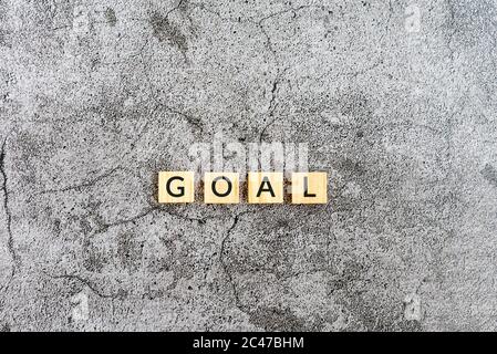 Goal text on wooden block textures background Stock Photo