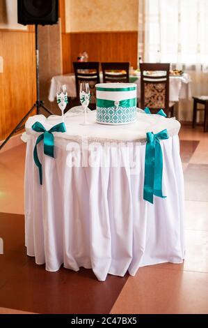 Pair of champagne glasses and cake box Stock Photo