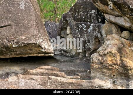 Phu Phra Bat Park Unusual rock formations formed by erosion Adapted as Buddhist shrines Weathered detail of buddha carvings in rock formations Stock Photo