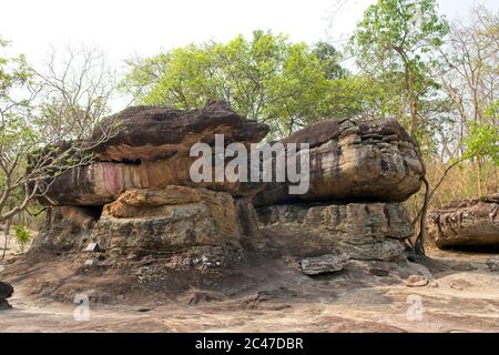 Phu Phra Bat Park, Unusual rock formations formed by erosion Adapted as Buddhist shrines Large boulders supported above ground allowing shelter Stock Photo