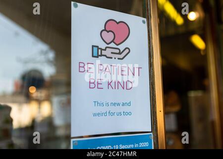 Sign at a shop showing guidance and rules for Coronavirus, UK Stock Photo