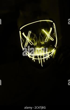 The Yellow Led Mask For Partying Isolated On A Dark Background Stock Photo Alamy