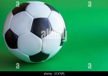 Sport, football, competitions, physical culture, healthy lifestyle concept - banner of flat lay close-up black and white classic soccer leather ball Stock Photo