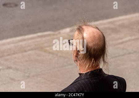 Montreal, Canada - 16 May 2020: Rear view of a bald man Stock Photo