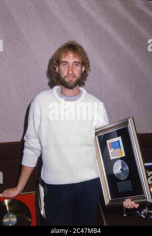 Genesis receiving gold discs backstage at the NEC Birmingham 26th February 1984. Mike Rutherford Stock Photo