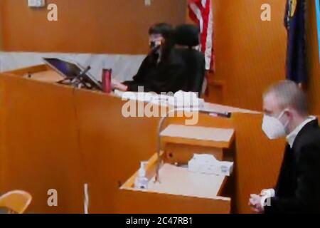 On this monitor image, stabbing survivor Micah Fletcher (R) gives a ...