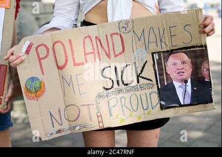Placard saying 'Poland makes me sick not proud' with a picture of Polish president, Andrzej Duda during the climate protest.Young people demand a response from the Minister of National Education, Dariusz Piontkowski, regarding the call for introducing climate education to the curricula. Stock Photo