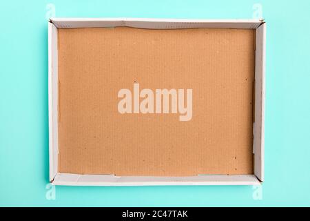 Top view of empty cardboard box as mock up copy space, overhead shot of worn rectangular cardboard container Stock Photo