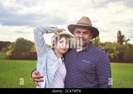 photo portrait of a happy middle-aged couple in nature, love concept Stock Photo