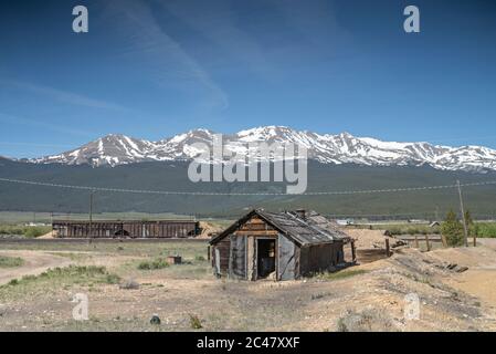 Abandoned wood structure and railroad freight cars in Leadville, Colorado, at the location of the former Oro City, Colorado, an abandoned ghost town Stock Photo