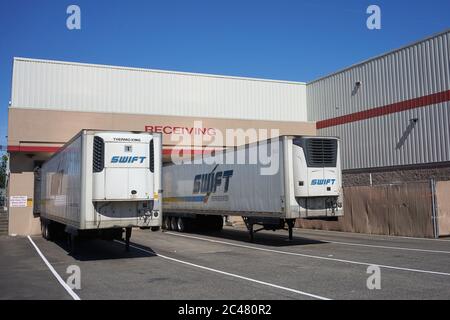 American trucking company Swift Transportation branded trucks are seen at a Costco Wholesale store in Tigard, Oregon, on Tuesday, June 23, 2020. Stock Photo