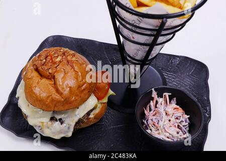 cheese melted barbecued beef burger with bowl of salad and french fries Stock Photo