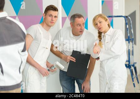 tutor and students on decorating course Stock Photo