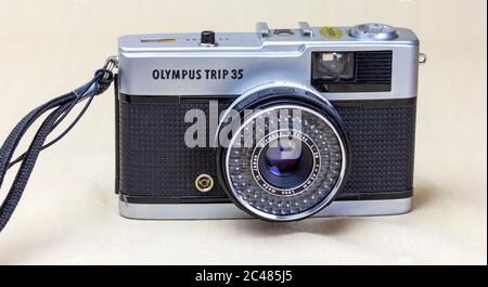 Front view of Olympus Trip 35 camera on table, a popular 35mm point and shot camera made famous by adverts with David Bailey in the 1980s. Stock Photo