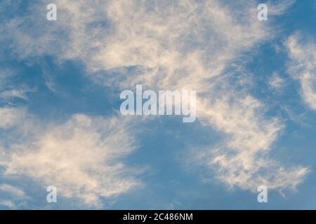 White Wispy Clouds Against a Blue Daytime Sky Stock Photo