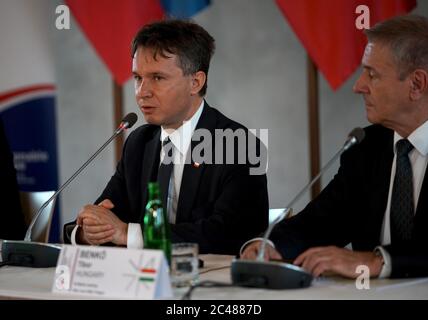 Prague, Czech Republic. 24th June, 2020. Polish Deputy Defense Minister Pawel Wozny (L) speaks during a press conference in Prague, the Czech Republic, on June 24, 2020. Defense ministers of Hungary, the Czech Republic, and Slovakia, and deputy defense minister of Poland, met here Wednesday to discuss mutual defense alliance before the handover of the group's presidency from the Czech Republic to Poland. Credit: Dana Kesnerova/Xinhua/Alamy Live News Stock Photo