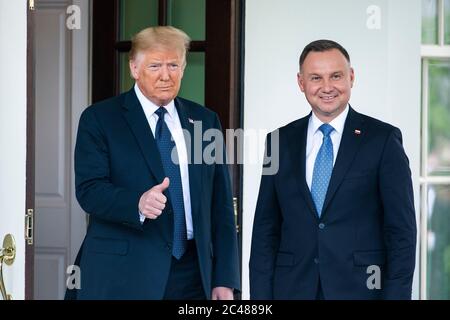US President Donald J. Trump (L) welcomes Polish President Andrzej Duda (R) to the White House in Washington, DC, USA, 24 June 2020. Duda, a conservative nationalist facing a tight re-election back home, is the first foreign leader to visit the White House in more than three months.Credit: Jim LoScalzo/Pool via CNP /MediaPunch Stock Photo