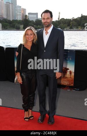 Tracks Producer Emile Sherman and wife Caroline Sherman arrive on the red carpet for the St George Openair Cinema’s opening night Sydney premiere of ‘ Stock Photo