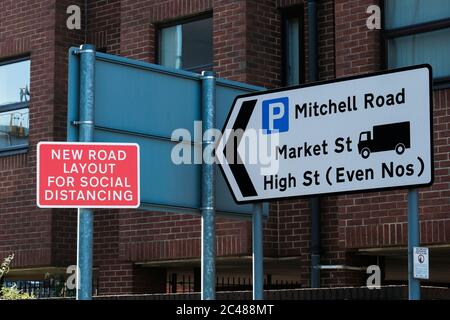 Eastleigh, UK. 24th June, 2020. Temporary new road layout sign enforcing social distancing as restrictions are lifted for the first time since the government mandated non-essential businesses to close due to the coronavirus pandemic. Credit: SOPA Images Limited/Alamy Live News Stock Photo