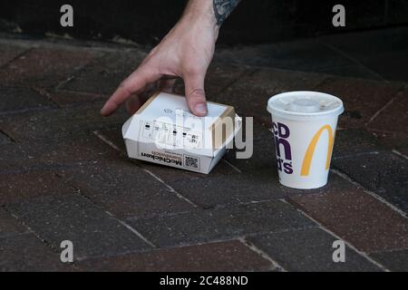 Eastleigh, UK. 24th June, 2020. McDonald's fast food burger and soft drink container as restrictions are lifted for the first time since the government mandated non-essential businesses to close due to the coronavirus pandemic. Credit: SOPA Images Limited/Alamy Live News Stock Photo