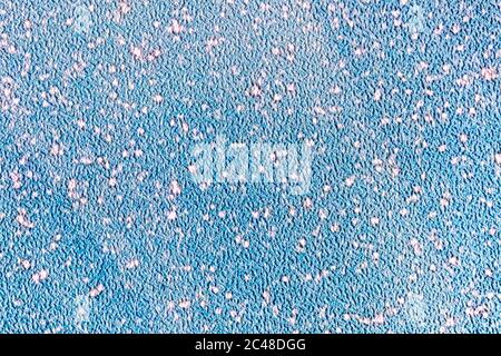 abstract artificial fabric background with rough texture. blue surface with white dots, spots and diagonal lines Stock Photo