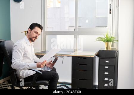 Young male working from his office - the concept of productivity Stock Photo