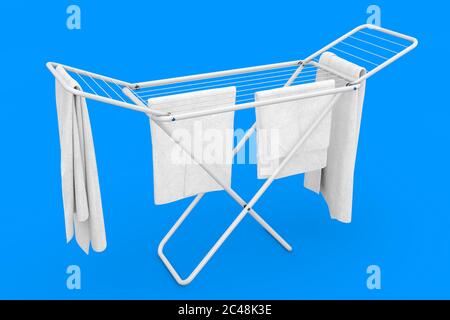 Clothes over White Folding Metal Clothes Drying Rack on a blue background. 3d Rendering Stock Photo