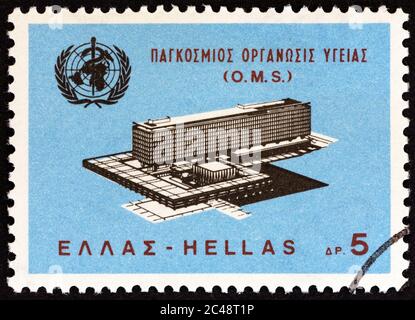 GREECE - CIRCA 1966: A stamp printed in Greece issued for the inauguration of the WHO Headquarters, Geneva shows WHO Headquarters, Geneva, circa 1966. Stock Photo