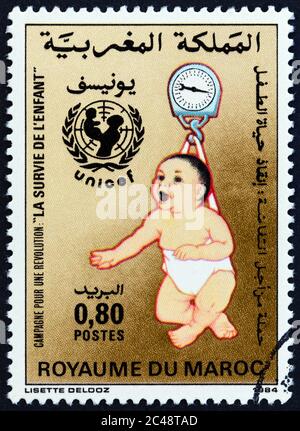 MOROCCO - CIRCA 1985: A stamp printed in Morocco issued for the Infant Survival Campaign shows growth monitoring, circa 1985. Stock Photo