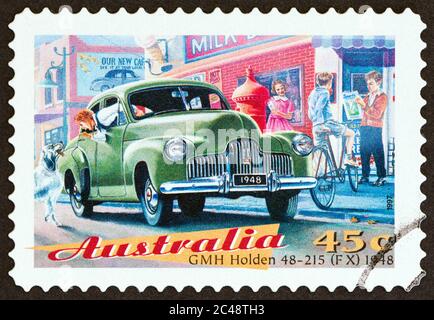 AUSTRALIA - CIRCA 1997: A stamp printed in Australia from the 'Classic Cars' issue shows GMH Holden 48-215 (FX) sedan, 1948, circa 1997. Stock Photo