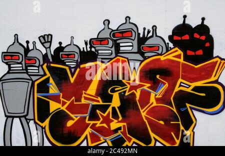 This red-eyed alien riot squad was among the artworks painted – legally – by street artists on a hoarding surrounding a former wine warehouse on the quayside of the northeast Italian port of Trieste, Friuli-Venezia Giulia, Italy, to promote Trieste Fest 2007, an international festival dedicated to the communication of science. Stock Photo