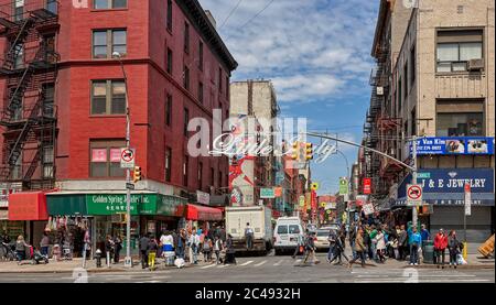 Street scene at the intersection of the Canal Street and Mulberry St. in the Little Italy district. Lower Manhattan, New York City, USA. Stock Photo