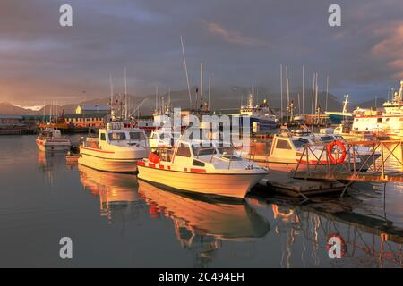 Dramatic sunset over the harbor town of Hofn (Höfn) in south-east Iceland. Stock Photo